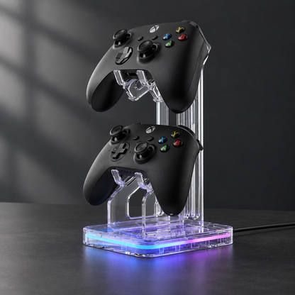 Clear RGB controller stand holding two controllers on a dark desk
