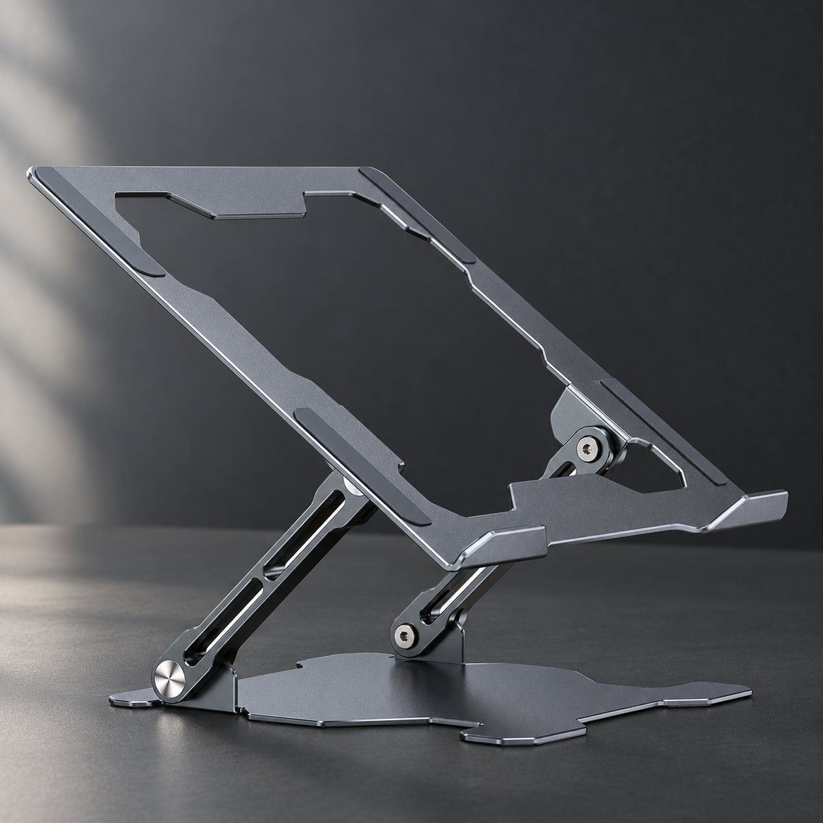 Aluminum laptop stand in grey on a dark desk